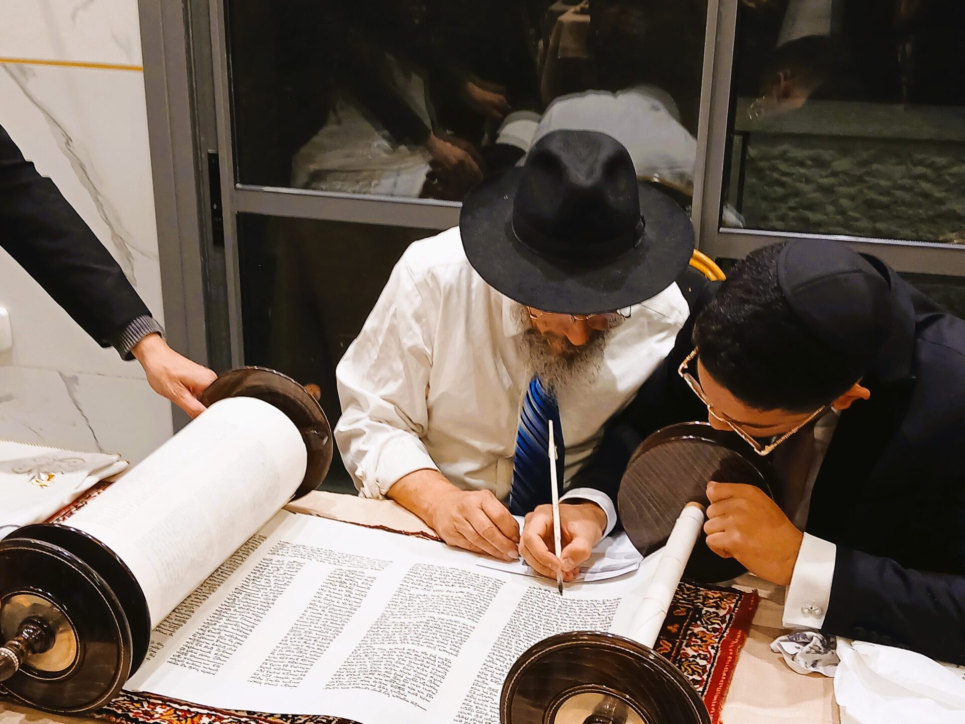 A Torah scroll being written