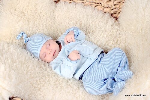 Newborn baby dressed for a Brit celebration