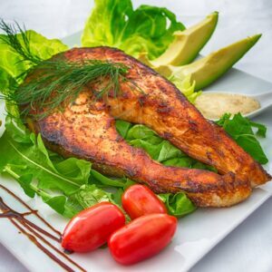 Prepared fish course with salad