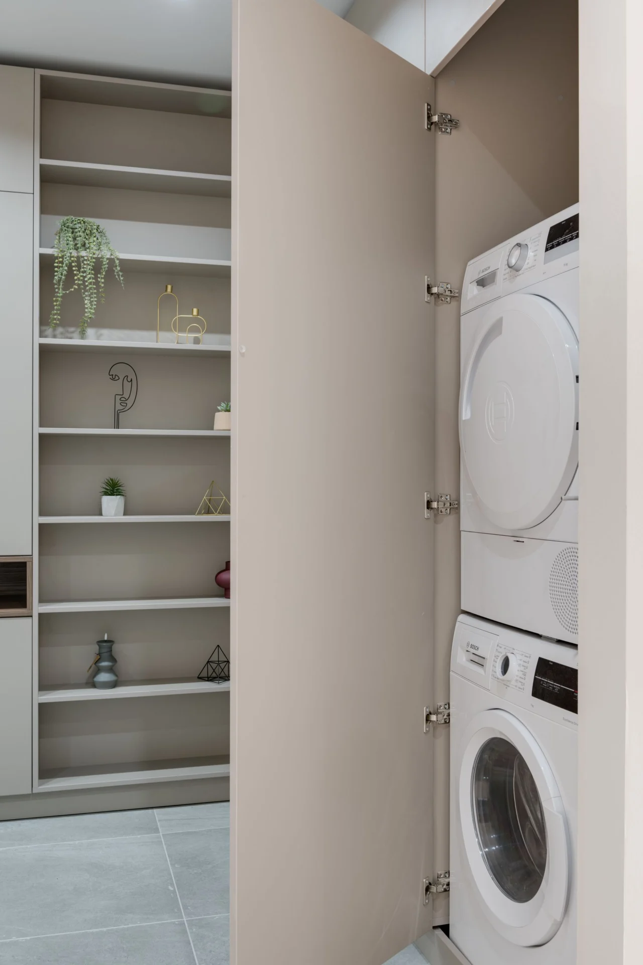 Tumble dryer in a home laundry cupboard