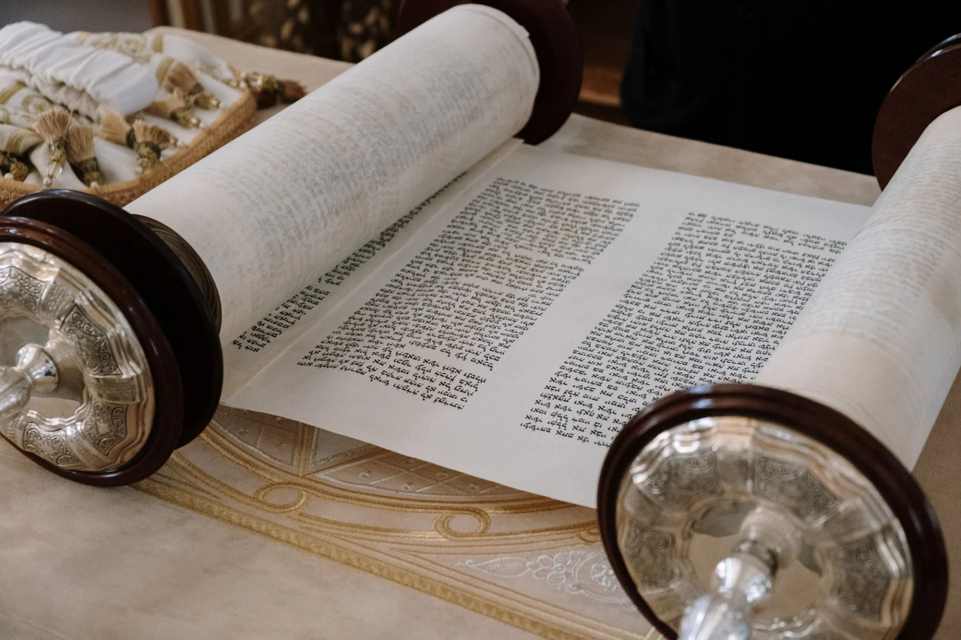Hand-written parchment scroll with its roller