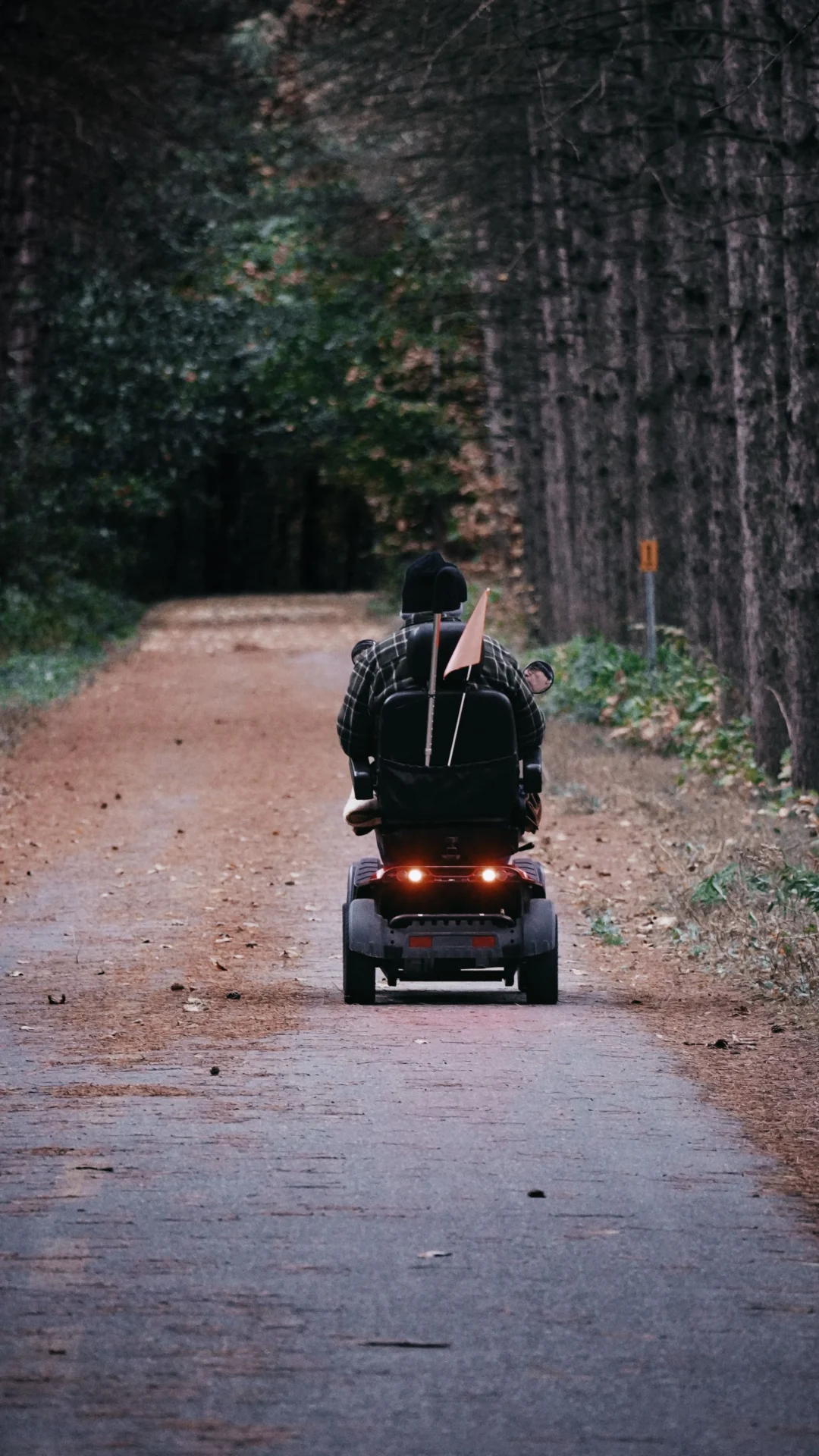Riding a mobility scooter outdoors